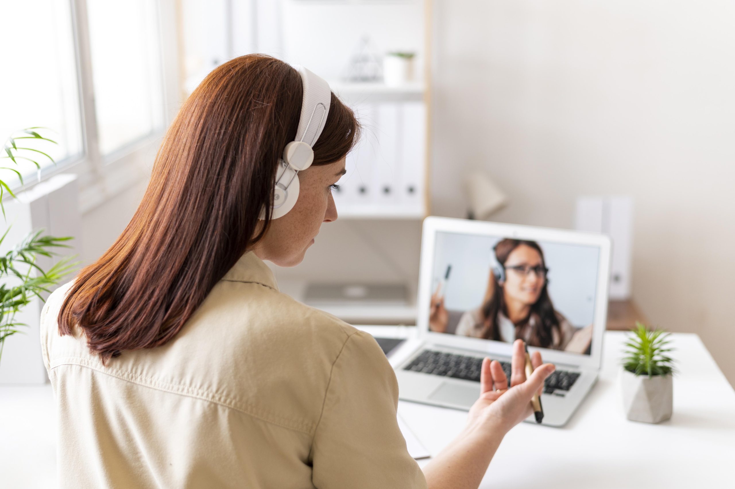 woman-work-having-video-call-laptop