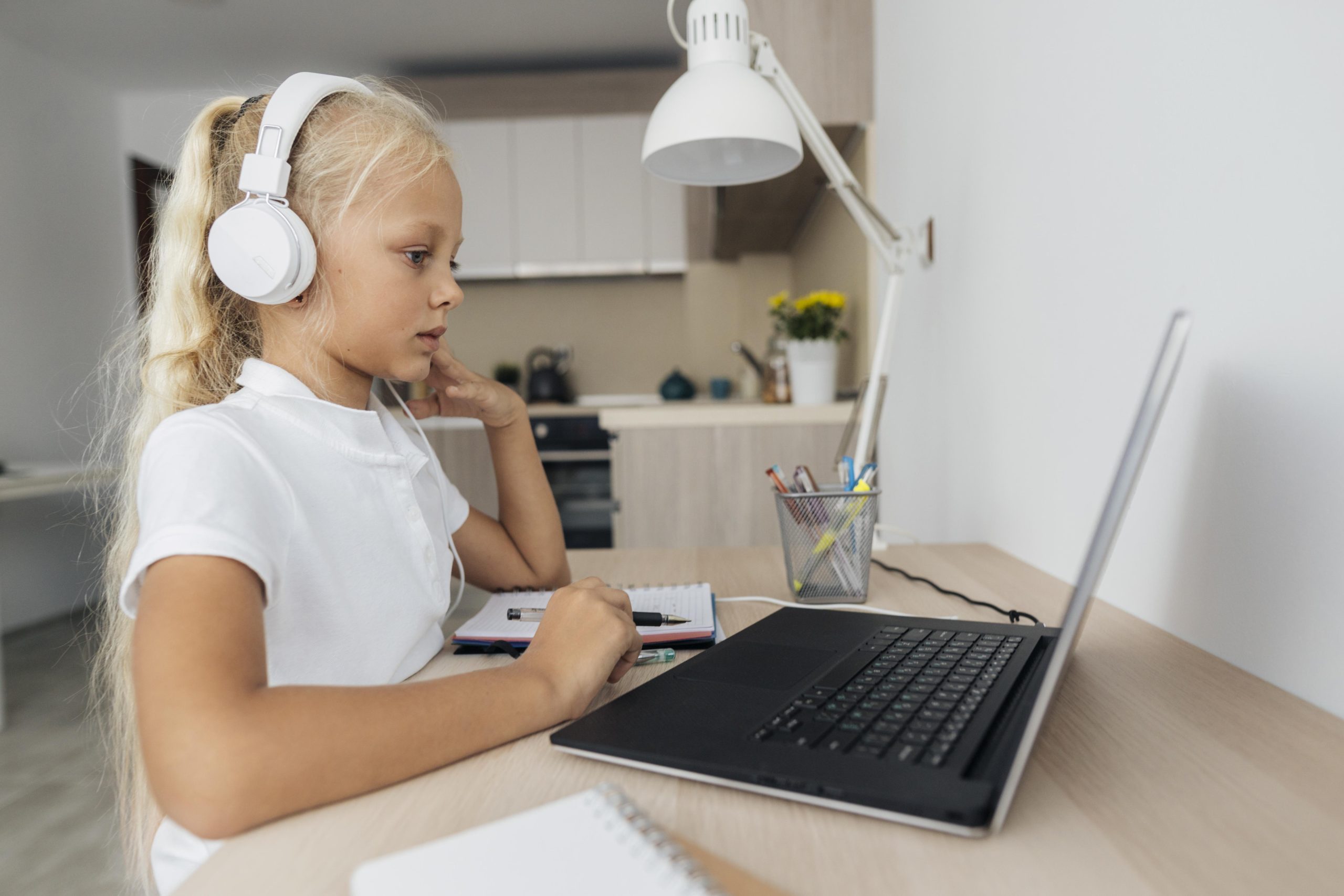 young-girl-paying-attention-online-class